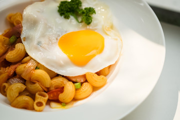 macaroni dish with fried egg