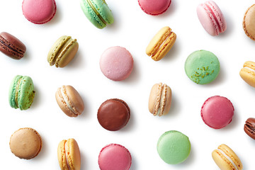 Colorful french macarons on white background