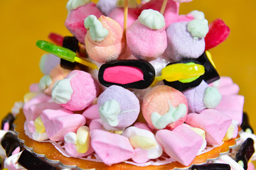Close up of a cake made with sugary and chewy candies, chupa chups