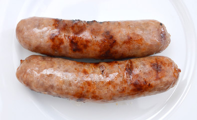 Grilled bratwurst isolated on white