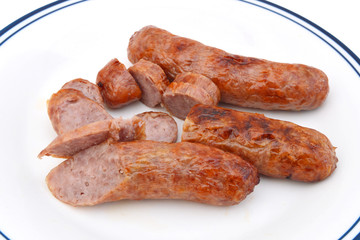 Grilled bratwurst  in white plate on white background