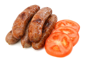 Frie sausage and slice tomato on white