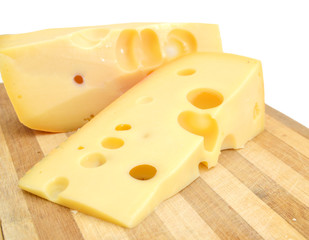 piece of cheese isolated on wooden board