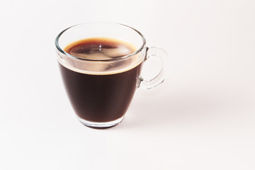 Coffee Americano in Glass small cup with foam white background