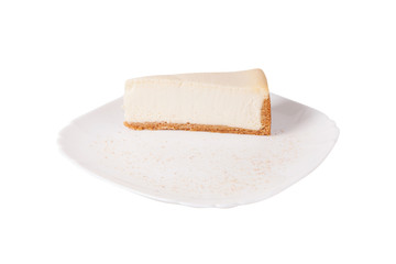 Classic cheesecake on a white plate isolated on white