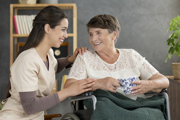 Smiling senior woman drinking tea