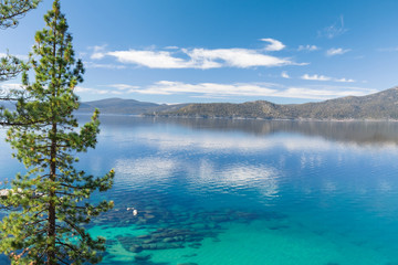 Fototapeta na wymiar Lake Tahoe east shore beach, calm turquoise water in sunny day