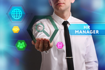 Business, Technology, Internet and network concept. Young businessman working on a virtual screen of the future and sees the inscription: HR manager