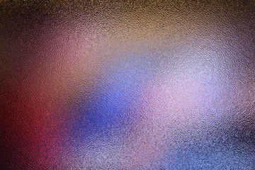 Frosted glass texture. Colorful lights background.