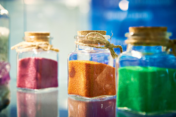 Glass jars with granules of dyes