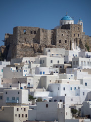 Naklejka premium Chora of Astypapaia island ,Greece at daytime a close up of the white houses that encircle the castle