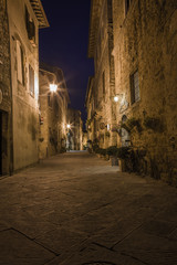 Fototapeta na wymiar Street view at night. Pienza town in Tuscany region in Italy 