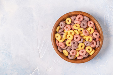 Colorful cereal rings in bowl.