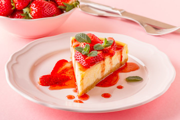 Delicious homemade cheesecake with strawberries.
