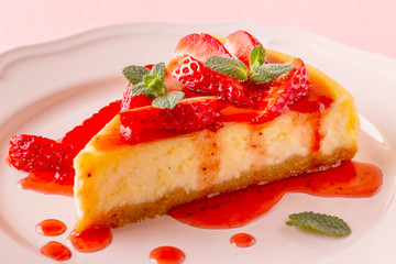 Delicious homemade cheesecake with strawberries.