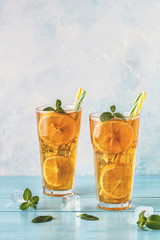 Iced tea with lemon slices and mint.