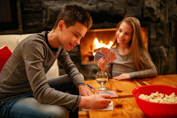 children playing cards together