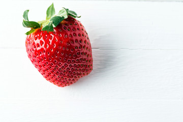 strawberry on a white wooden table