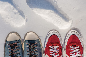 sneakers in the snow, fashionable bright sneakers