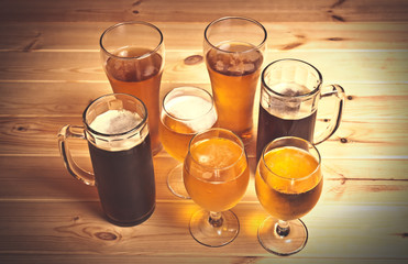 Dark and light beer on wooden table. Selective focus.