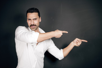 Young handsome man with beard and mustache studio portrait