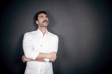 Young handsome man with beard and mustache studio portrait