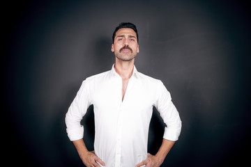Young handsome man with beard and mustache studio portrait