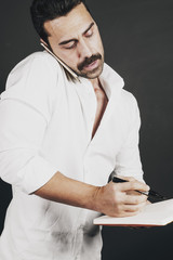 Young handsome man with beard and mustache studio portrait