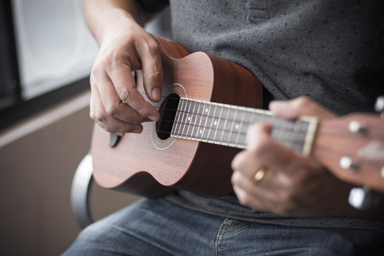 Man Playing Ukelele With Selective Focus