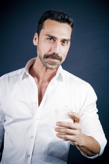 Fototapeta na wymiar Young handsome man with beard and mustache studio portrait