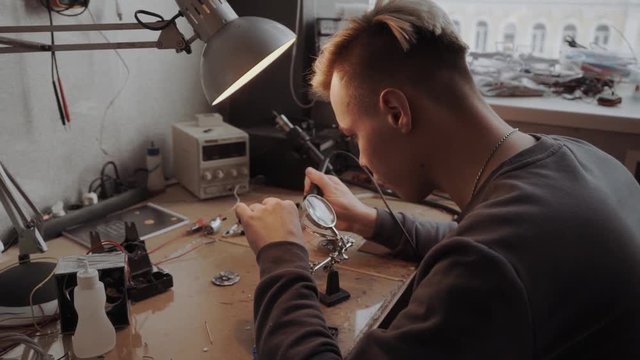 Young professional is working on a microscheme