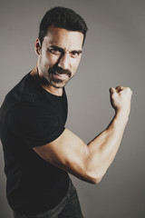Young handsome man with beard and mustache studio portrait