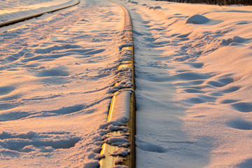railway rails covered with snow