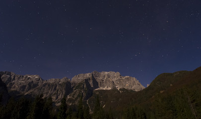 Obraz na płótnie Canvas night scene of Alps mountain and stars