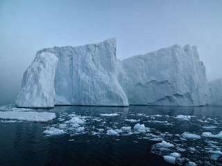 Fototapeta na wymiar Most Arctic icebergs originate from the fast-flowing glaciers that descend from the Greenland Ice Sheet. 