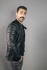 Young handsome man with beard and mustache studio portrait