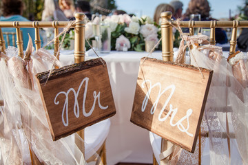 Mr and Mrs Wood Painted Signs on Bride and Groom Chair at Wedding
