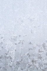 Winter frosty patterns on the frozen ice window
