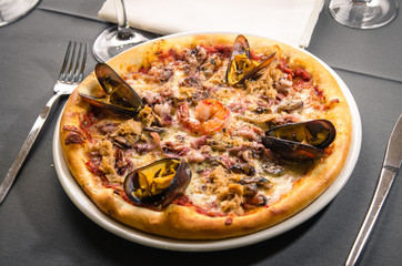 Pizza with seafood and salmon