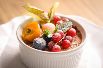 Creme brulee with berries close
