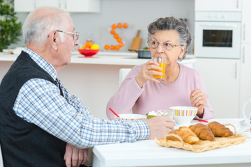 old couple having breakfast