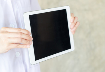 women long hair doctor holding tablet