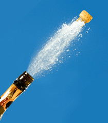 a bottle of champagne on a blue background