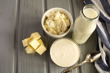 Farm dairy products on the grey  wooden  background.Top view.