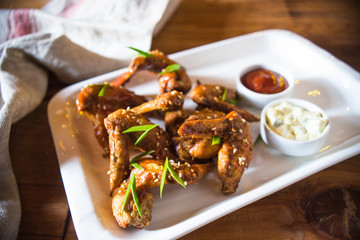 Grilled chicken wings with hot sauce