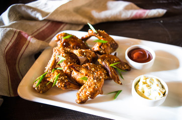 Grilled chicken wings with hot sauce