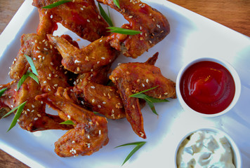 Grilled chicken wings with hot sauce