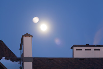 Full moon over roof