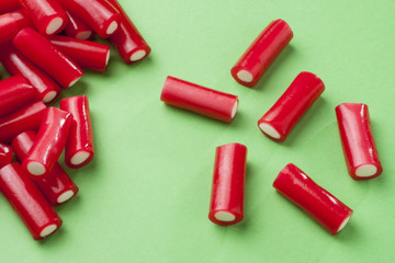 Colorful candy on green background