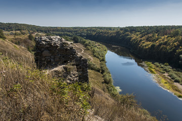 Fototapeta na wymiar Ruins of the castle in Gubkiv, view on river Sluch, Rivno region, Volyn, Ukraine